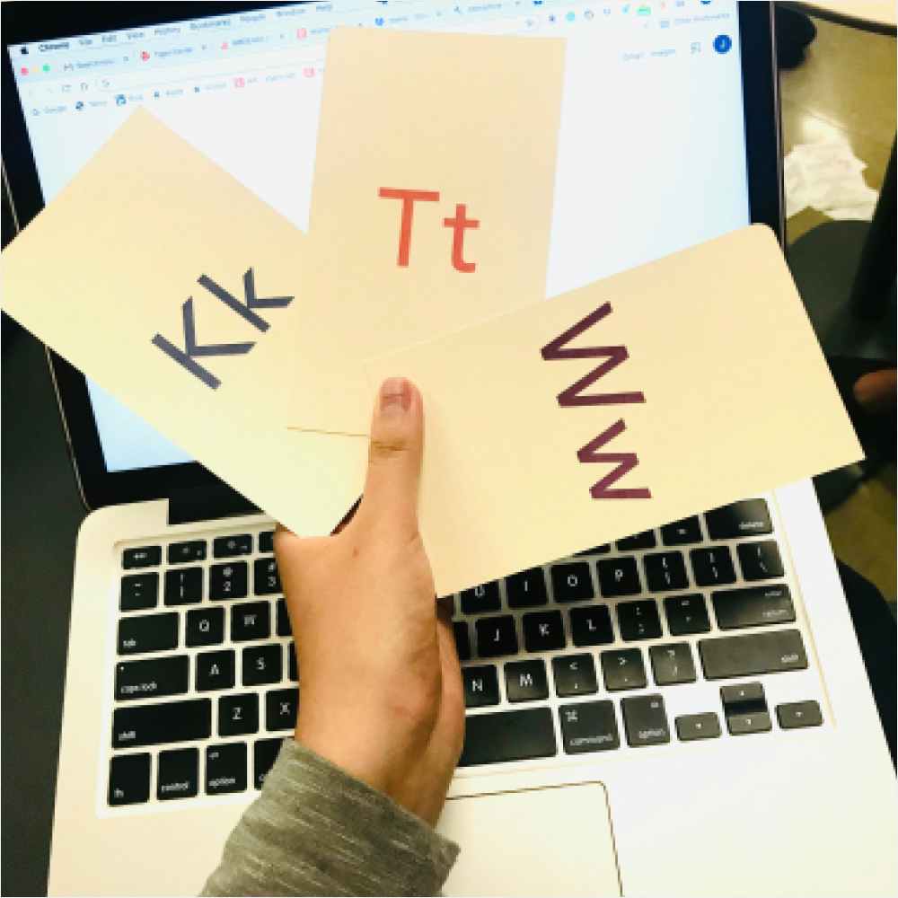 A hand holding my three selected letters K, T and W A hand holding my three selected letters K, T and W