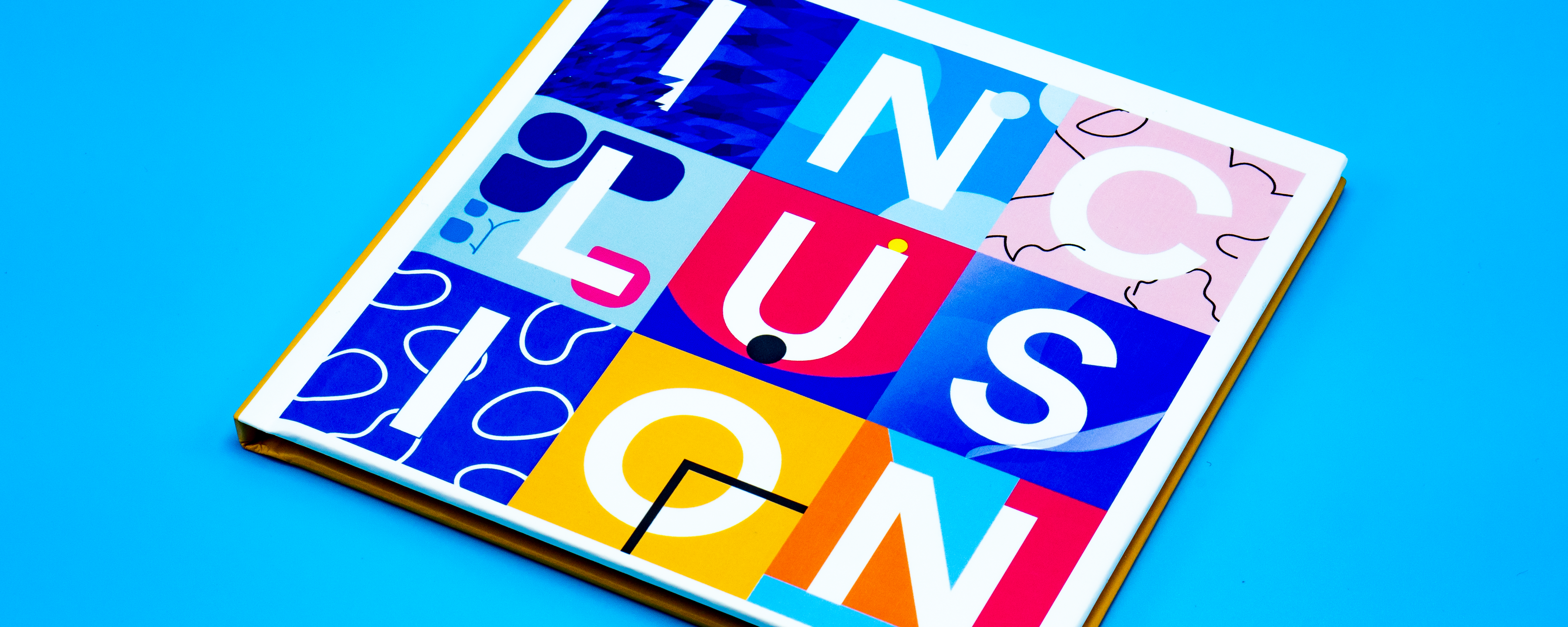 Photo of book with the word inclusion written on the cover.