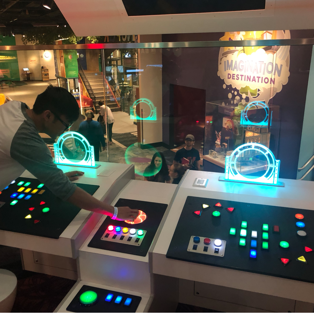 Jaymart playing with the spaceship controls at Strong Museum.