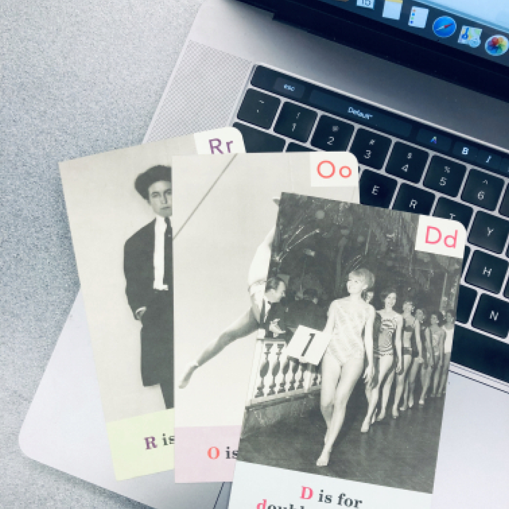 Hand holding cards with letters R, O, and D